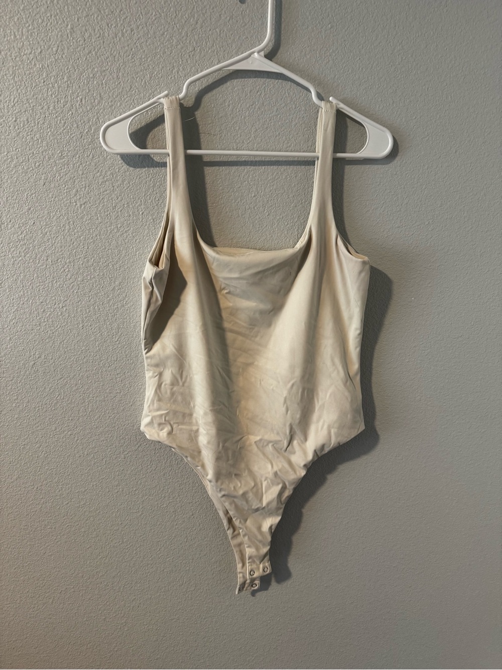 Cream One-Piece Bodysuit